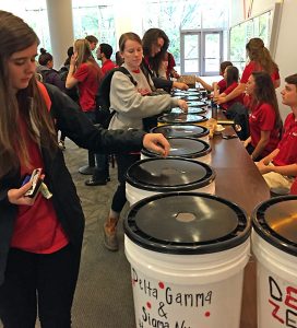 Students support NCSU Libraries during Homecoming Penny Wars.