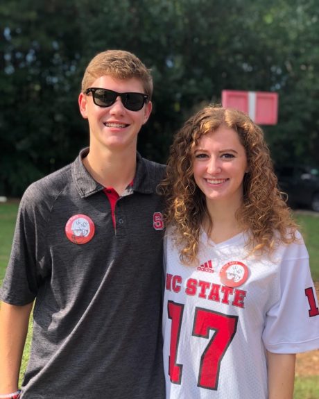 Abby Scheper and her brother Ethan on the field at Carter-Finley Stadium
